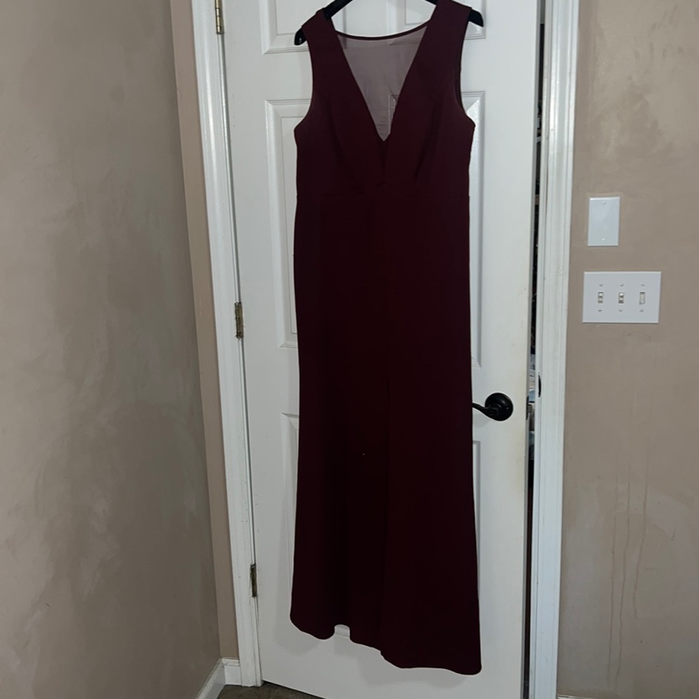 Burgundy color Formal dress size 18 worn once with shear front. Gown worn once.